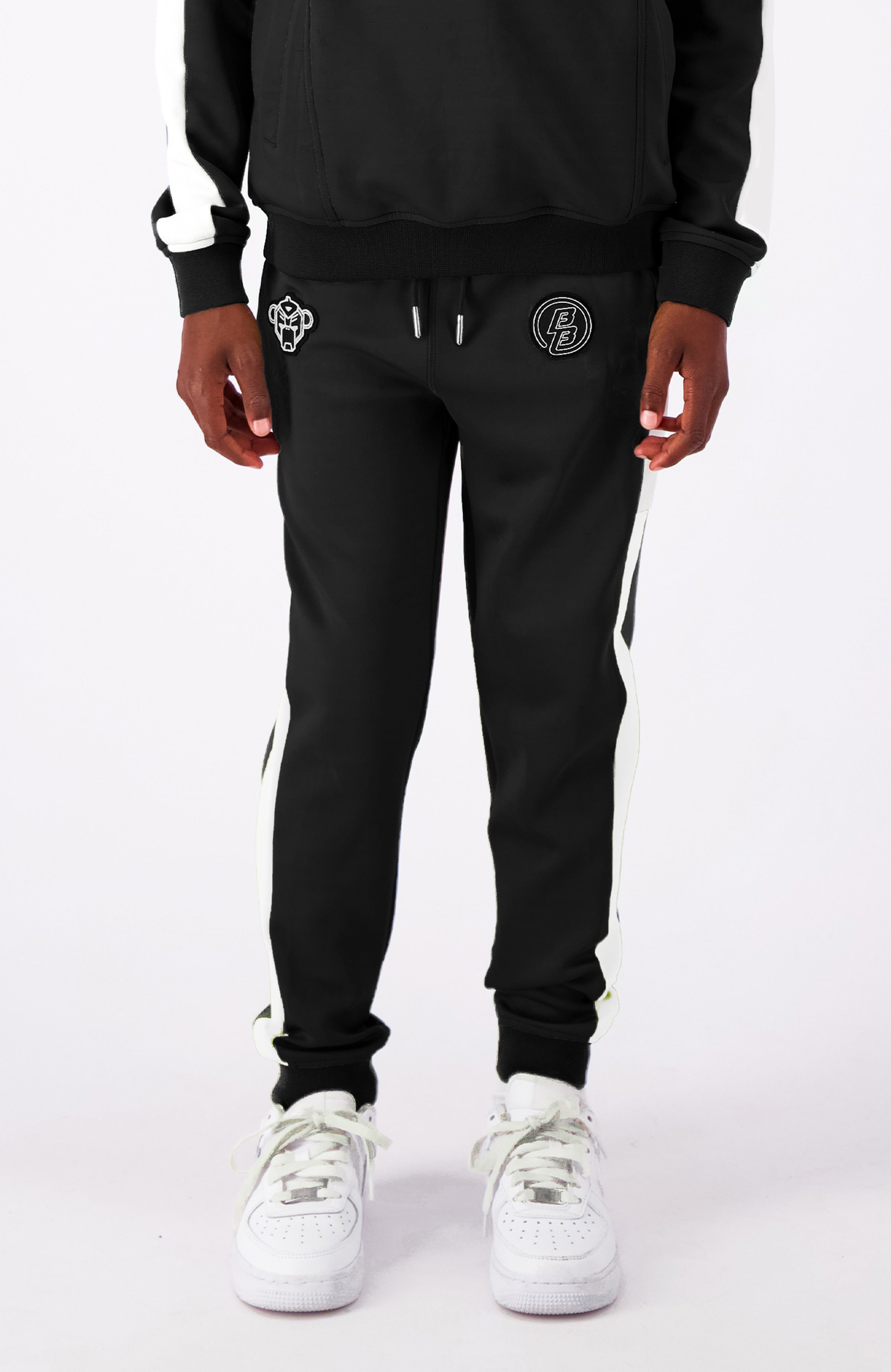 JR. ANORAK pantalón deportivo | Negro
