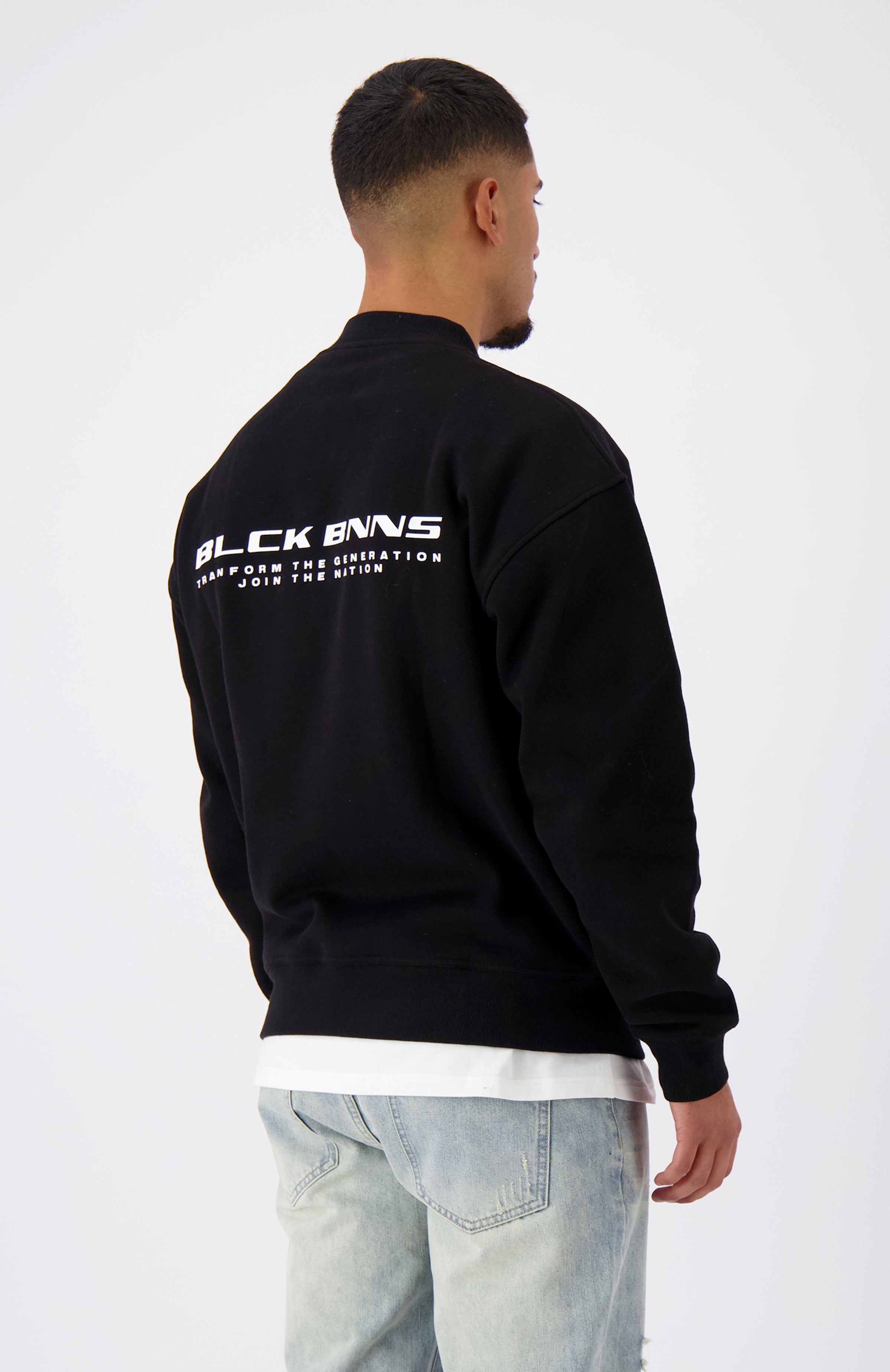 //blackbananas.com/cdn/shop/files/NATION_SWEATER_1.224.2.26-000000-top-07_{width}x.jpg?v=1727084655