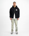SUDADERA CON CREMALLERA RIPADA | Negra